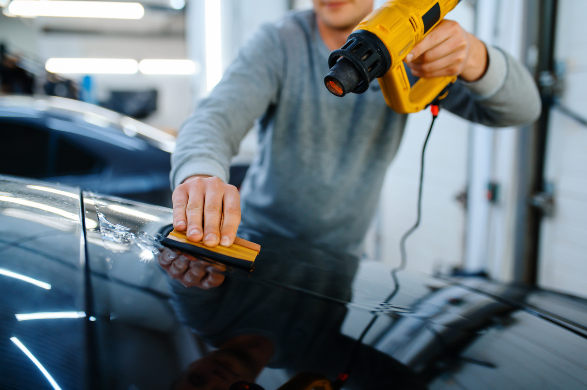 Wrapper Holds Squeegee and Heat Gun, Car Tinting
