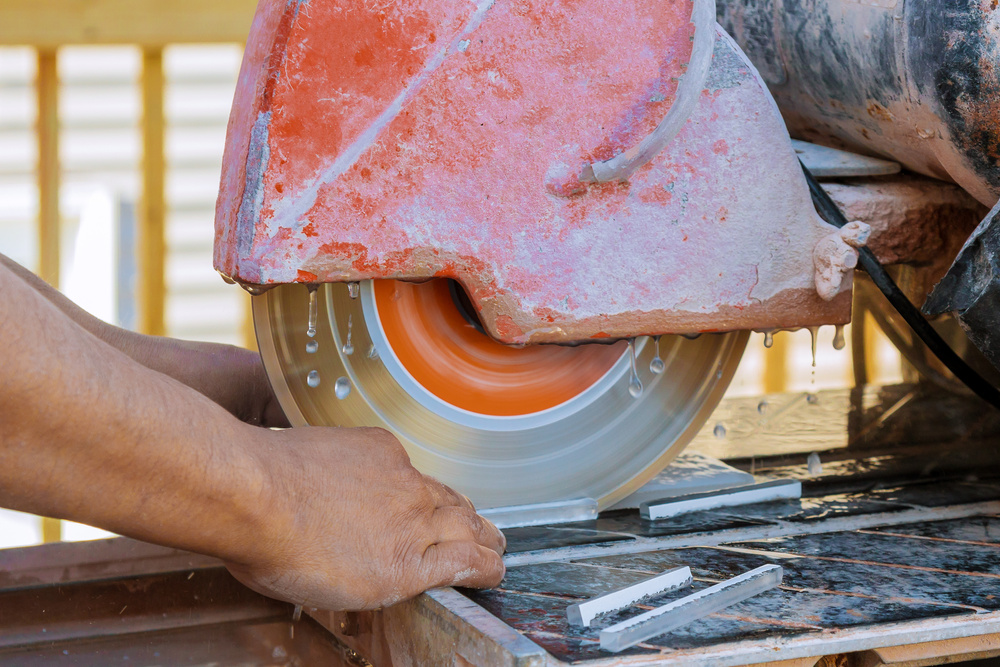 Circular Saw Cutting Ceramic Tile Electro Saw on the Constructio